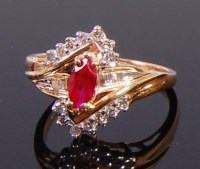 Lot 2341 - A 10ct gold, ruby and moissanite dress ring,...