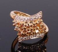 Lot 2343 - A modern 9ct gold multi-diamond set dress ring...