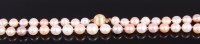 Lot 2346 - A modern cultured and knotted pearl single...