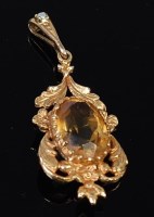 Lot 2167 - A 9ct gold and citrine set pendant, the large...