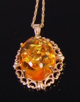 Lot 2355 - A modern 9ct gold and clear orange amber set...