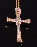 Lot 2359 - A 9ct gold and diamond set cross pendant, the...