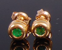 Lot 2364 - A pair of 14ct gold and emerald set ear studs,...