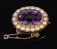 Lot 2242 - A yellow metal, amethyst and seed pearl set...