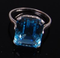 Lot 2379 - A white metal and aquamarine dress ring, the...