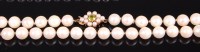 Lot 2348 - A cultured and knotted pearl single string...