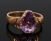 Lot 2007 - A ladies 9ct gold amethyst set dress ring, the...