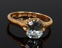 Lot 2008 - An 18ct gold aquamarine set dress ring, the...