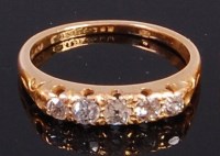 Lot 2013 - An 18ct gold diamond five stone ring, the...