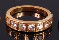 Lot 2014 - An 18ct gold diamond set half eternity ring...
