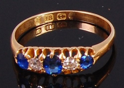 Lot 2020 - An 18ct gold, sapphire and diamond ring, the...