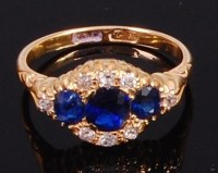 Lot 2037 - An 18ct gold, sapphire and diamond dress ring...