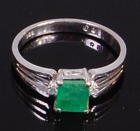 Lot 2040 - A contemporary 14ct white gold, emerald and...