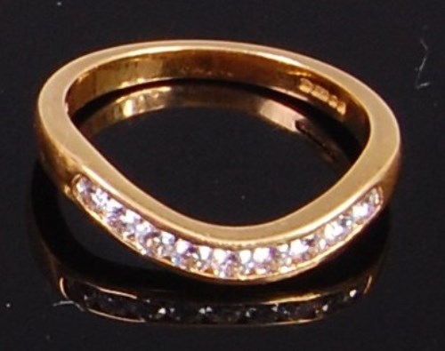 Lot 2041 - An 18ct gold and diamond set wishbone ring...