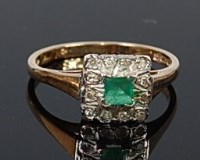 Lot 2057 - A 9ct gold, emerald and diamond cluster ring,...
