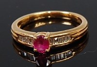 Lot 2065 - An 18ct gold, ruby and diamond dress ring,...