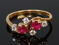 Lot 2067 - An 18ct gold, ruby and diamond dress ring...