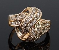 Lot 2079 - A modern 9ct gold diamond set dress ring, the...