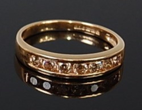 Lot 2081 - An 18ct gold diamond half eternity ring having...