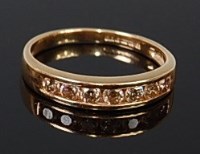Lot 2081 - An 18ct gold diamond half eternity ring having...