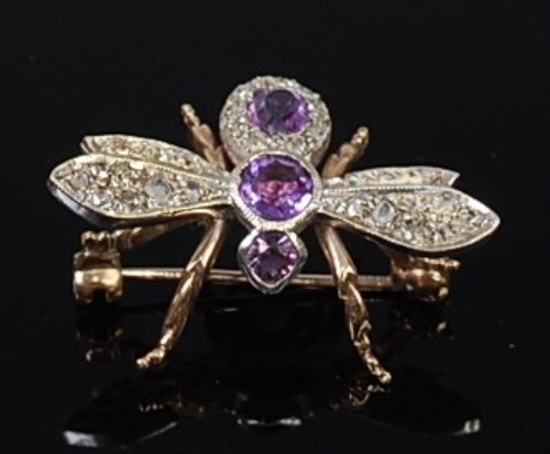 Lot 2083 - A 9ct gold, amethyst and diamond set brooch in...
