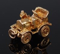 Lot 2092 - A 9ct gold charm modelled as a vintage car,...