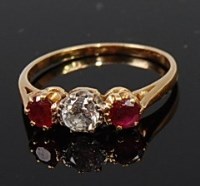 Lot 2110 - An 18ct gold, ruby and diamond ring, the claw...