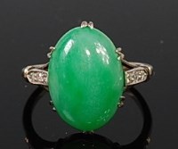 Lot 2112 - An 18ct white gold and platinum jade set ring,...