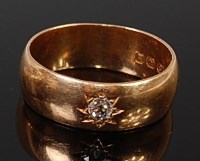 Lot 2114 - An 18ct gold diamond band ring, the gypsy set...