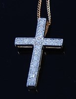 Lot 2115 - A 9ct gold diamond set cross pendant, the pavé...