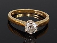 Lot 2126 - An 18ct gold diamond solitaire ring, the claw...