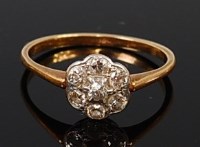 Lot 2138 - An 18ct gold diamond flower head cluster ring,...