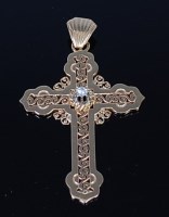 Lot 2143 - An 18ct gold diamond set cross pendant, in...