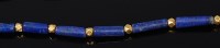Lot 2154 - A lapis lazuli sectional necklace, divided...