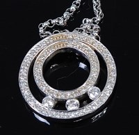 Lot 2165 - A 14ct white gold diamond set pendant, the...