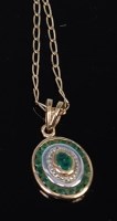 Lot 2168 - A 9ct gold emerald set pendant, on finelink...