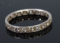 Lot 2169 - A platinum and diamond set eternity ring,...