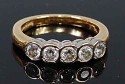 Lot 2172 - An 18ct gold diamond five stone ring, the...