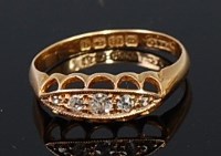Lot 2178 - A George V 18ct gold diamond five stone ring,...