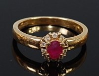 Lot 2181 - A modern 18ct gold, ruby and diamond ring,...