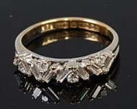 Lot 2187 - An 18ct gold diamond half hoop ring, set with...
