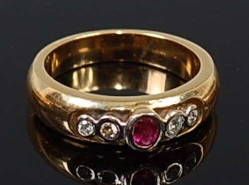 Lot 2189 - An 18ct gold, ruby and diamond ring, arranged...