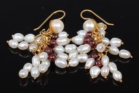 Lot 2193 - A pair of cultured pearl and garnet set ear...