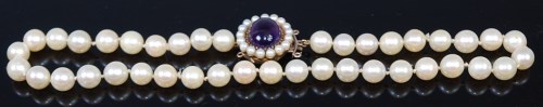 Lot 2196 - A cultured and knotted pearl single string...