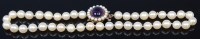 Lot 2196 - A cultured and knotted pearl single string...
