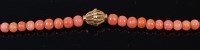 Lot 2198 - A beaded coral necklace, with high carat...