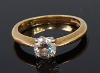 Lot 2199 - An 18ct gold diamond solitaire ring, the four...