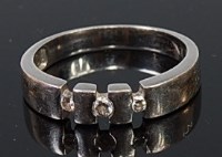 Lot 2200 - A modern platinum and diamond dress ring,...
