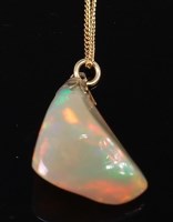 Lot 2205 - A polished opal pendant, weighing approx 11ct,...