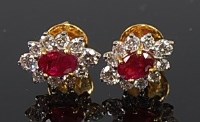 Lot 2215 - A pair of yellow metal, ruby and diamond set...